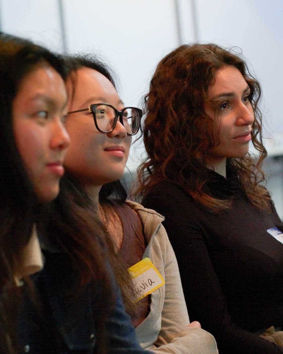 Attendees listening to the speakers