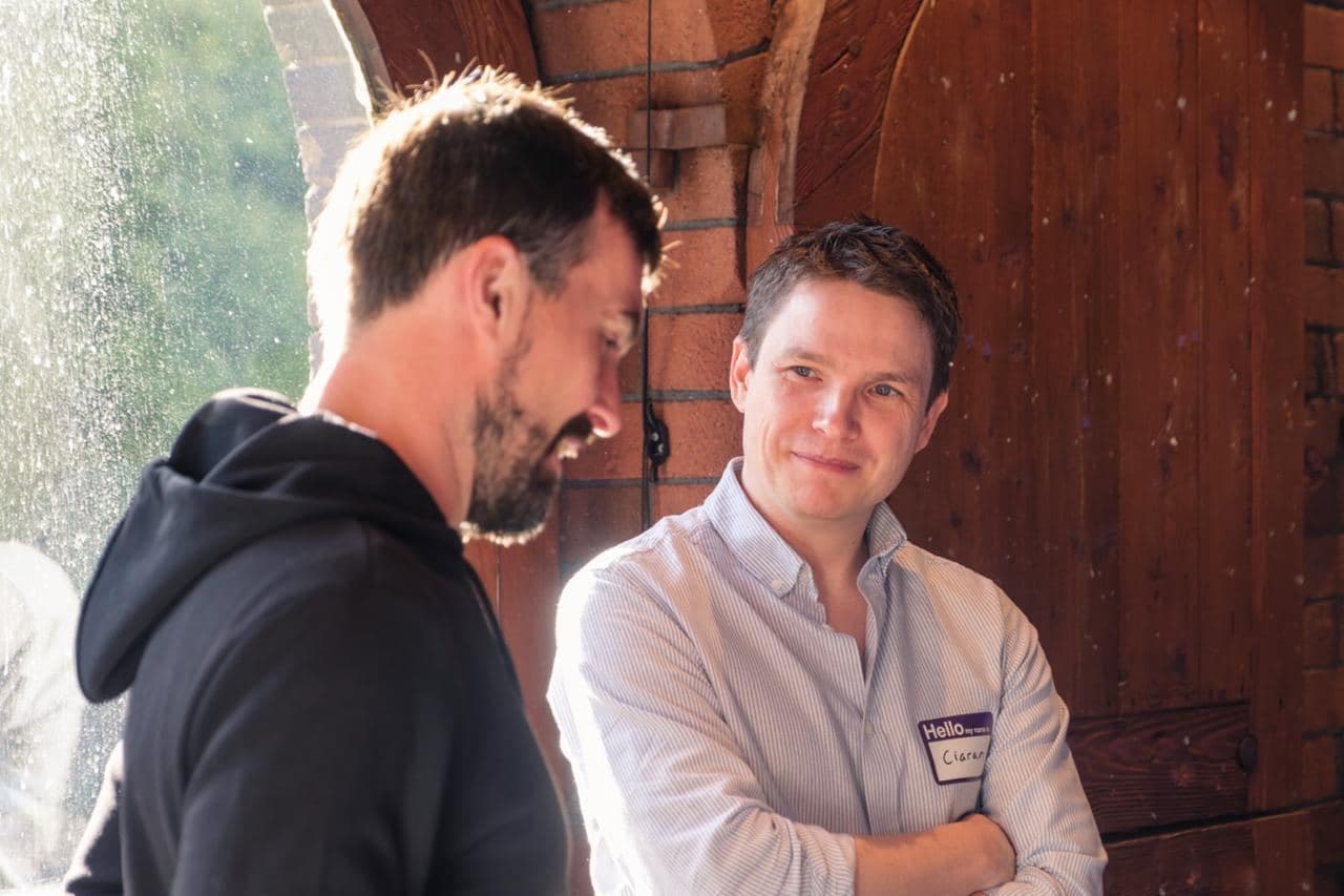 Two attendees in conversation